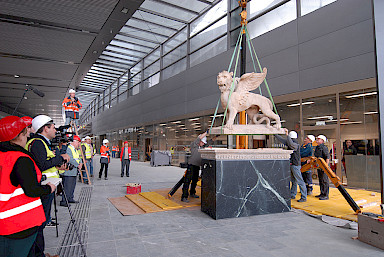 Raising the Lion of St. Mark on base with base plate