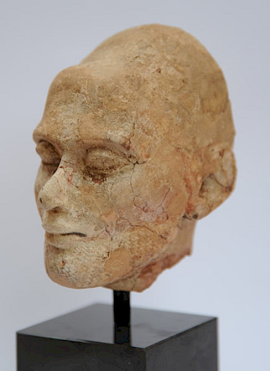 fragmented limestone head, after preservation